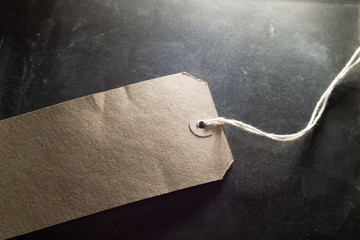 Brown blank  labels with string on background