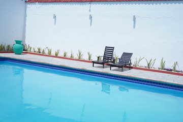 sunbeds pool blue summer
