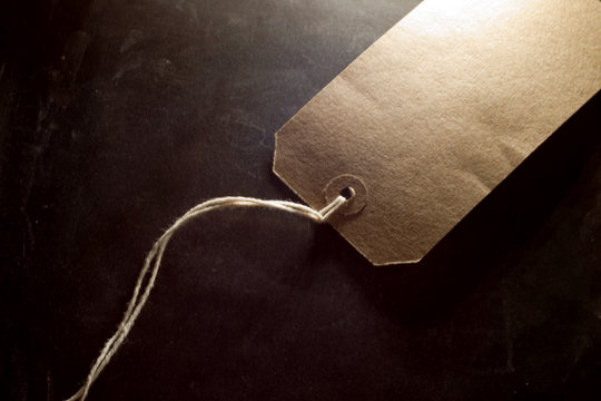Brown blank  labels with string on background