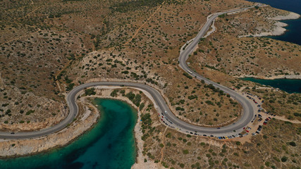 Aerial view photo of road in Athens riviera seaside known limanakia forming small bays with turquoise clear sea, Vouliagmeni, Attica, Greece
