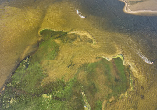 Aerial view of people kitesurfing on caiupe Lagoon in Brazil.
