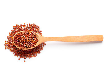 Brown quinoa in a wooden spoon isolated on white background