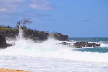 Ocean waves breaking along a rocky beach