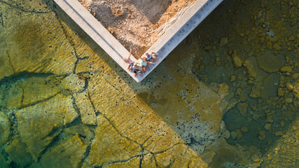 Aerial selfie of four friends on island Syros, Greece.