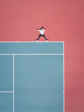 Aerial concept of a person on a tennis court.