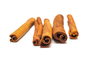 cinnamon sticks on a white background, candiedness, isolate for designers
