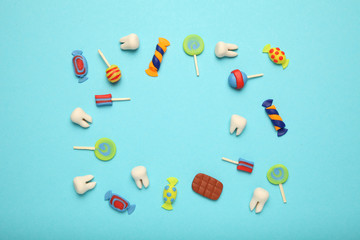 Teeth with sweet candies. Tooth caries in children's, dental healthcare.