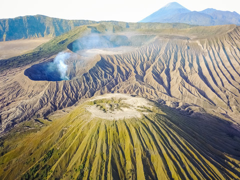Aerial view of crater with smoke of the active volcano Bromo in Indonesia