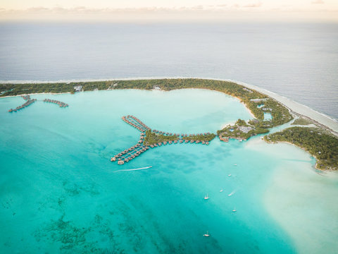 Aerial view of touristic bungalow in Bora-Bora island, in French Polynesia.