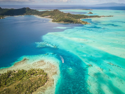 Aerial view of a boat in the reef in Bora-Bora, French Polynesia.