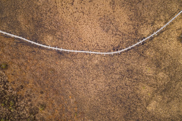 Aerial view of bridge going through swamp area at beautiful Valgjarv lake in Estonia