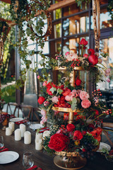 Obraz premium Wedding table flowers with fruits and berries decor in red white pink green colors.
