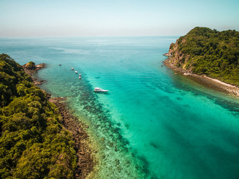 Aerial view of a yacht moored in paradisiacal bay of Koh Rok Yai island in Thailand.