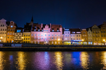 Fototapeta na wymiar Gdansk, Poland - February 07, 2019: View of Gdansk's Main Town from the Motlawa River at night. Gdansk, Poland