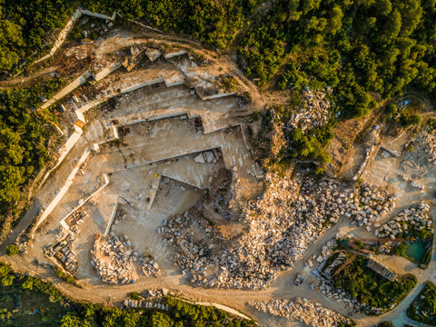 Aerial view of quarry, white famous Brac stone and trees, Brac island Croatia.