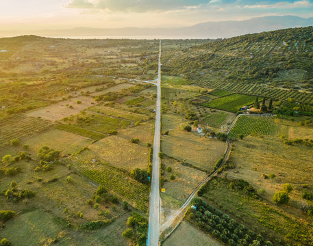 Aerial panoramic view of long road in Nerezisca dalmatian village, hills and seaside, Brac Island, Croatia.