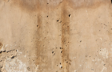 Old yellow clay wall background or texture, vintage style