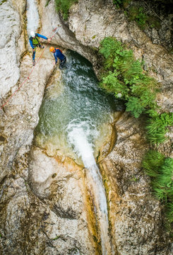 Aerial view two men canyoning.