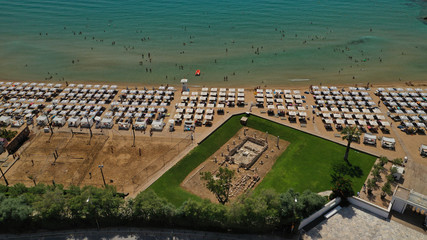 Aerial view of iconic emerald sandy celebrity beach of Asteras or Astir, Vouliagmeni, Athens riviera, Attica, Greece