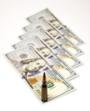 bullets on american dollars background Ammunition from the gun on money bills