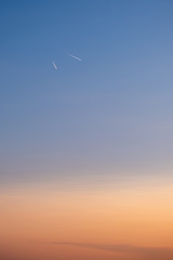 Abstract view of diverging airplanes during sunset.