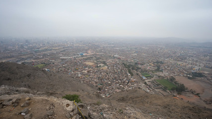 Fototapeta na wymiar Aerial panorama of the poor districts of Lima in Peru.