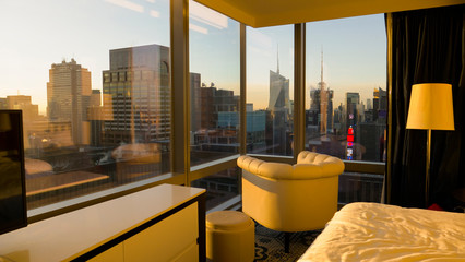 CLOSE UP: Spectacular view of downtown New York at sunrise from a hotel room.