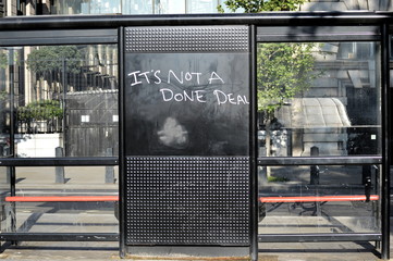 Graffiti against brexit at a bus stop of London