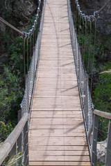 Fototapeta na wymiar wooden suspension bridge