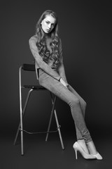 Teen girl posing in studio. Black and white photo