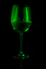 glass of wine on black background