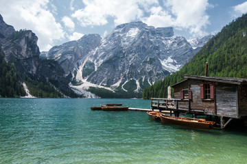 Lake Braies with vivid colors in spring with mountains in the background in the north of Italy