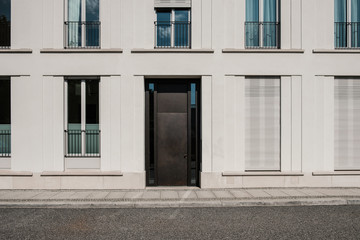 Fototapeta na wymiar entrance door on modern building with empty street , house door