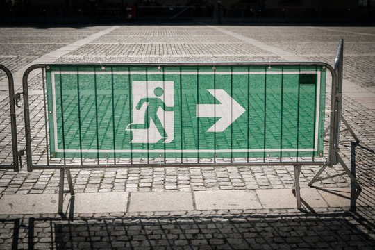 emergency exit sign on security fence for