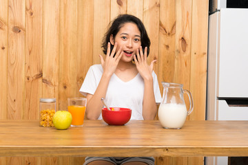 Asian young woman having breakfast milk with surprise facial expression