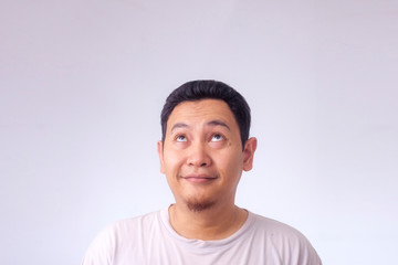 Young Man Thinking and Looking Up, Having Good Idea