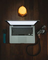 Photographer's laptop next to his gear