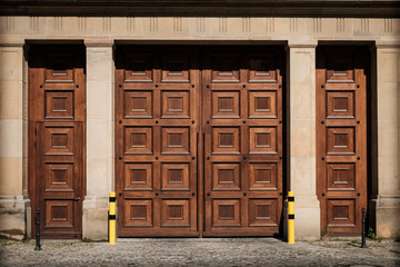 massive wooden gate entrance on building - huge wood door  -