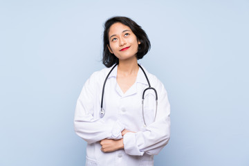 Doctor Asian woman looking up while smiling