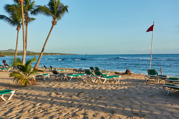 Tropical sandy beach at sunrise. Beach infrastructure