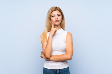 Teenager girl over isolated blue background counting ten with fingers