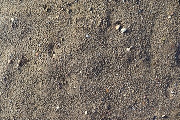 Close up detailed view on sandy ground surfaces in high resolution