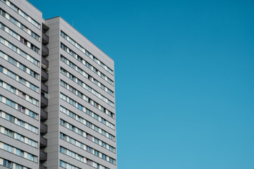 Fototapeta premium residential building , apartment building facade with blue sky copy space