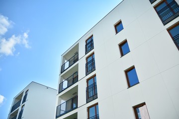 Multistory new modern apartment building. Stylish living block of flats.