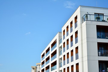 Multistory new modern apartment building. Stylish living block of flats.