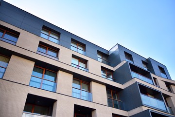 Multistory new modern apartment building. Stylish living block of flats.