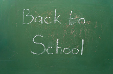 back to school on green school blackboard