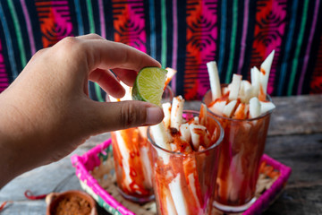 Mexican jicama fruit cutted with lime, chili powder and chamoy