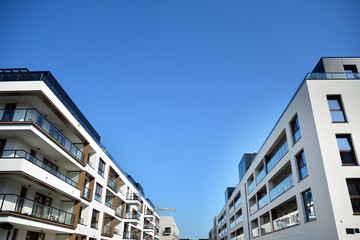 Multistory new modern apartment building. Stylish living block of flats.