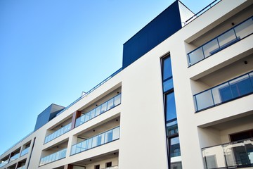 Multistory new modern apartment building. Stylish living block of flats.